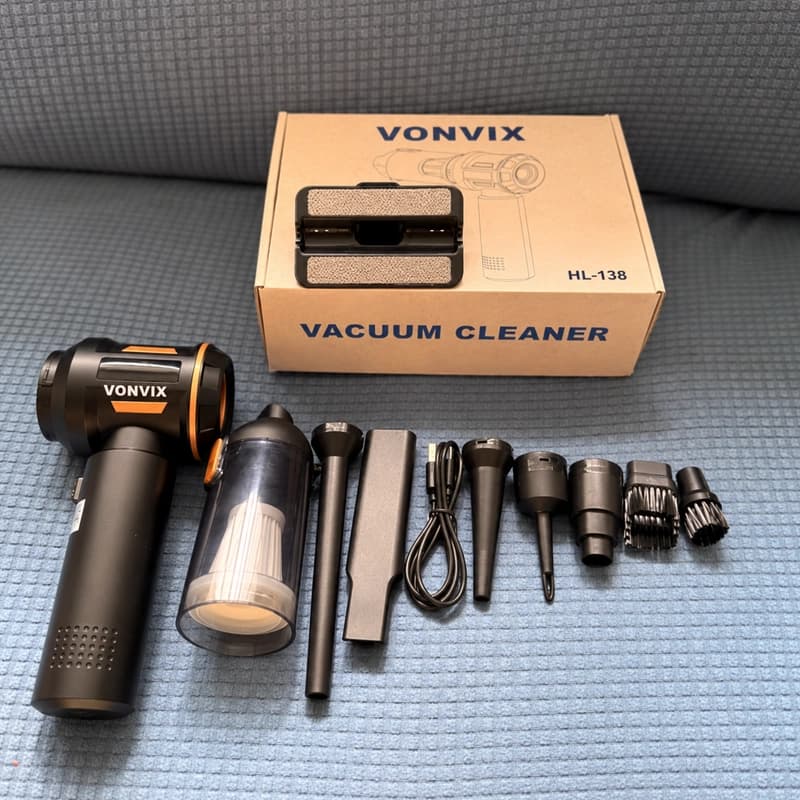 VONVIX HL-138 labeled carton beside a black and copper vacuum, USB cable and laid-out attachments